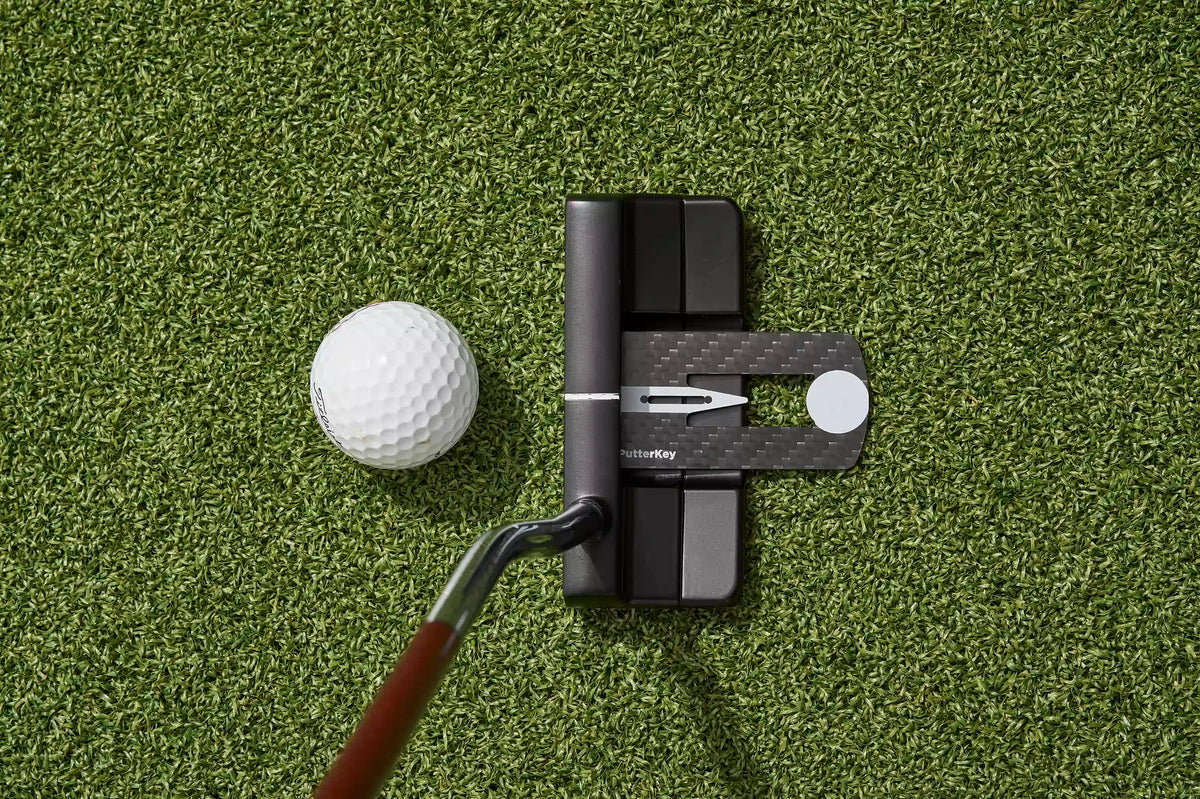 Putter Key positioned behind a blade putter face