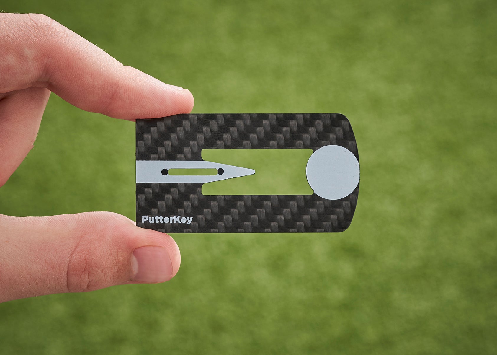 Putter Key putting training aid, close up with hand